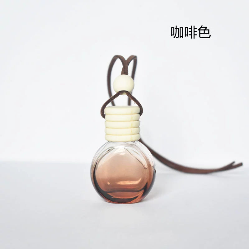 Yüksək səviyyəli Avtomobil Aromaterapiya Yanğınsöndürmə Şüşələri Öz-özünə quraşdırılmış Ətir Alt Butulkaları Avtomobil Asma Ornament Efir Yağı Uçucu Aroma Diffuzoru Qalıcı Ətir