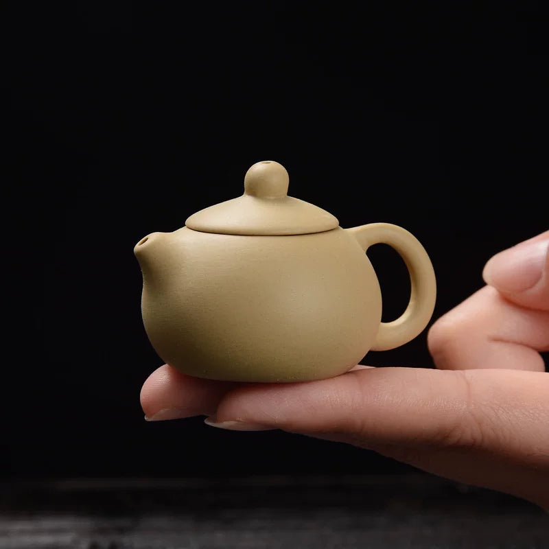 Butik çay heyvanı bəzəkləri mini bənövşəyi gil qablar, kiçik cib barmaq ucu qablar, çay oyuncaqları, çay dəstləri, çay masaları, kunq fu çay dəstləri saxlaya bilər.