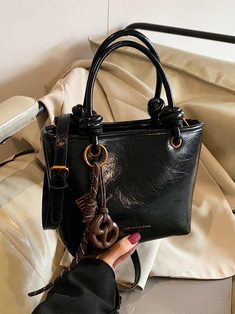 Yüksək səviyyəli, trenddə olan qadınlar üçün kiçik çanta, 2025-ci ilin yeni payız/qış üslubunda, vedrə çantası, sadə lüks, niş üslublu çarpaz bədən çantası.