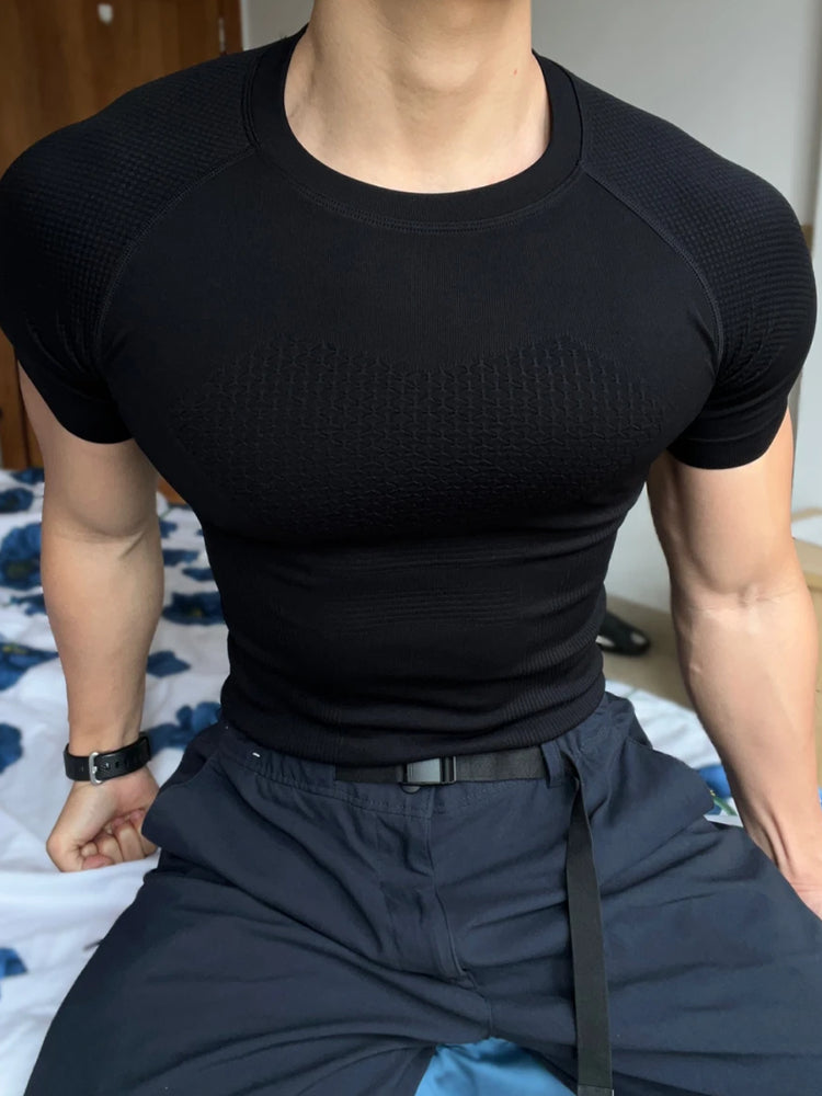 GYM elastik peşəkar fitness geyimi tikişsiz qısaqol idman köynəyi kişi qaçış məşqi tez quruyan sıxılma sıx açıq geyim