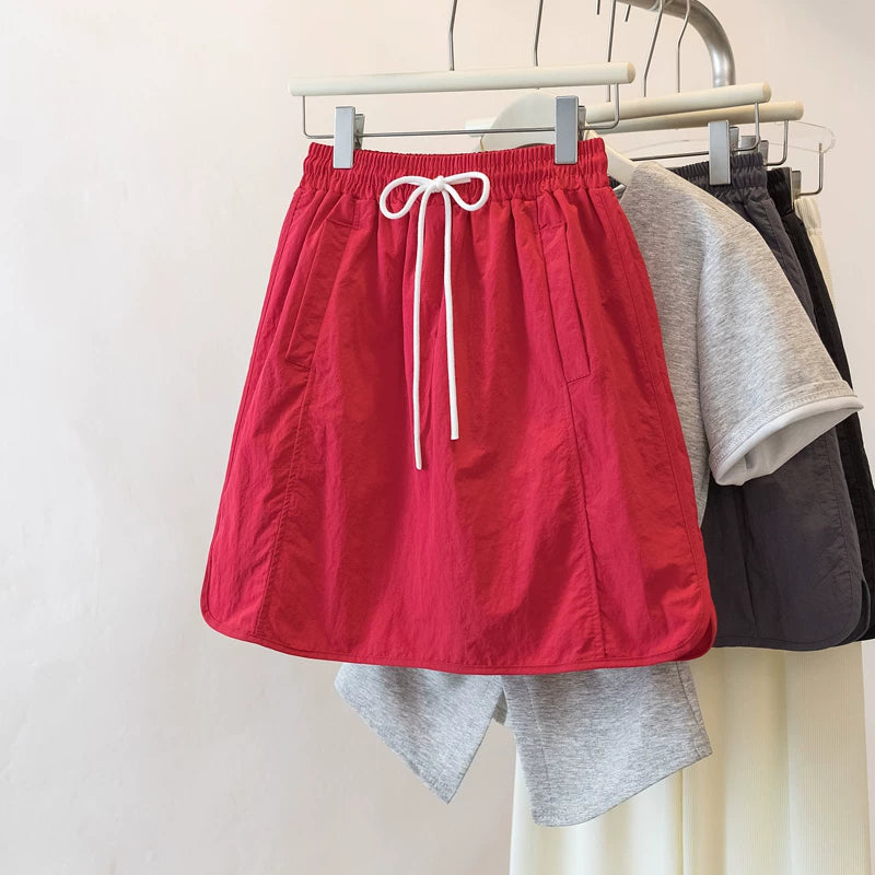 Qadınlar üçün Böyük Ölçülü Şirin və Sərin Yüksək Belli A-xəttli Ətək, 2026 Yeni Yay Modeli, Böyük Ölçülü Armud Formalı Fiqurlar üçün Arıqladıcı Yük Ətəyi