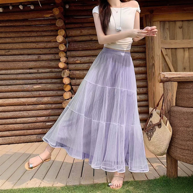 Fransız üslubunda qadınlar üçün yüksək belli torlu midi ətək, yay aylarında, böyük ölçülü qadınlar üçün idealdır, arıqladır və kalçaları gizlədir, A-xətti çoxmərtəbəli ətək.