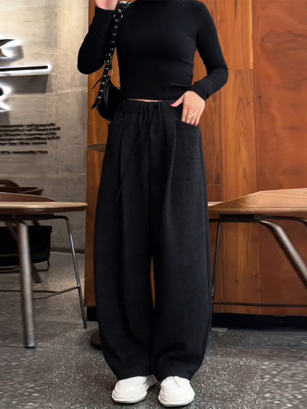 Qara rəngli, geniş ayaqlı, dartılan şalvar, yeni payız/qış stilində, böyük ölçüdə, geniş formalı, arıqladıcı, rahat, gündəlik, idman şalvarı.