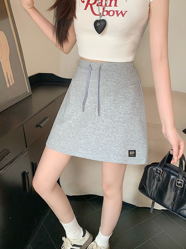 Böyük ölçülü qadın gündəlik idman sviteri, 2026-cı il yay yeni dəbi, yüksək belli, kalçanı örtən, arıqladıcı A-xəttli ətək/qısa ətək