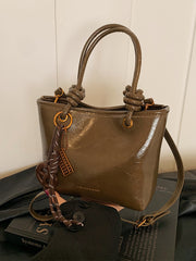 Yüksək səviyyəli, trenddə olan qadınlar üçün kiçik çanta, 2025-ci ilin yeni payız/qış üslubunda, vedrə çantası, sadə lüks, niş üslublu çarpaz bədən çantası.