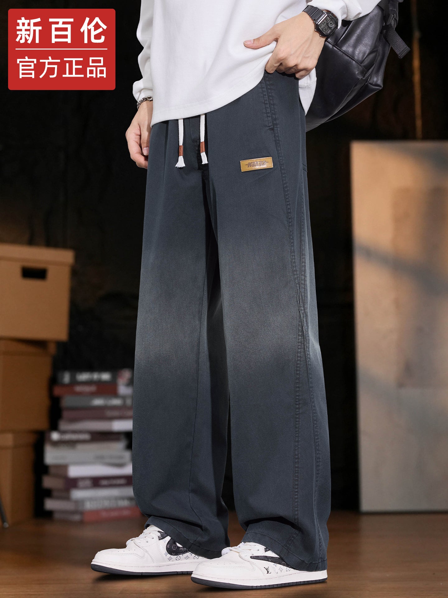 New Balance kişilər üçün Amerika üslubunda enli ayaqlı cins şalvar, 2025-ci ilin payız/qış yeni üslubunda, boş, düz ayaqlı Tencel gündəlik şalvarı.