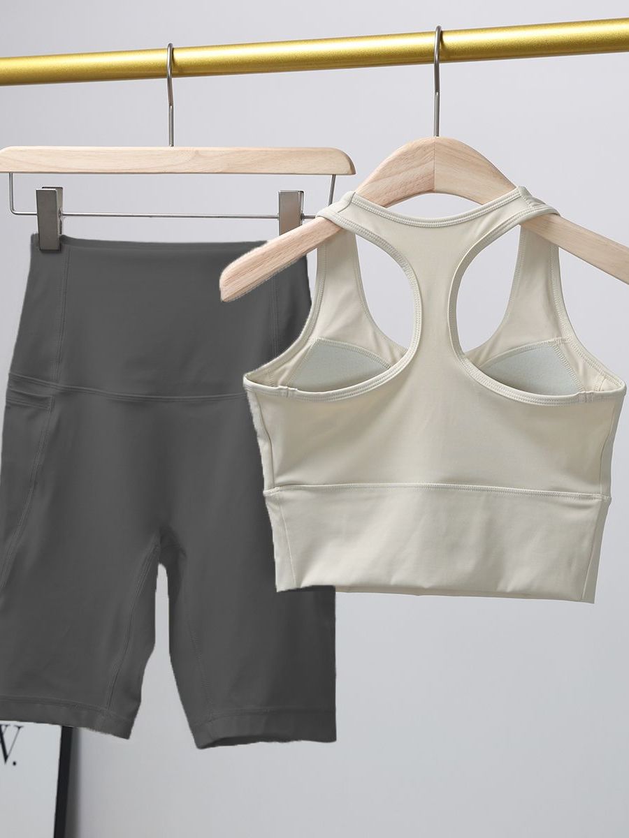 Qadınlar üçün fitnes dəsti 2026 yeni səhər qaçışı zərbəyə davamlı idman büstqalter dəsti İnternet məşhur yoqa beş nöqtəli şalvar iki parçalı dəst