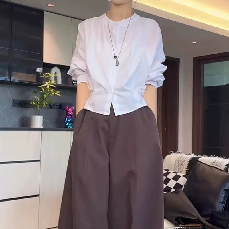 Qadınlar üçün böyük ölçülü, şık qara köynək, 2026-cı ilin yazının əvvəlləri üçün yeni model, geniş formalı, arıqladıcı, uzunqol köynək.