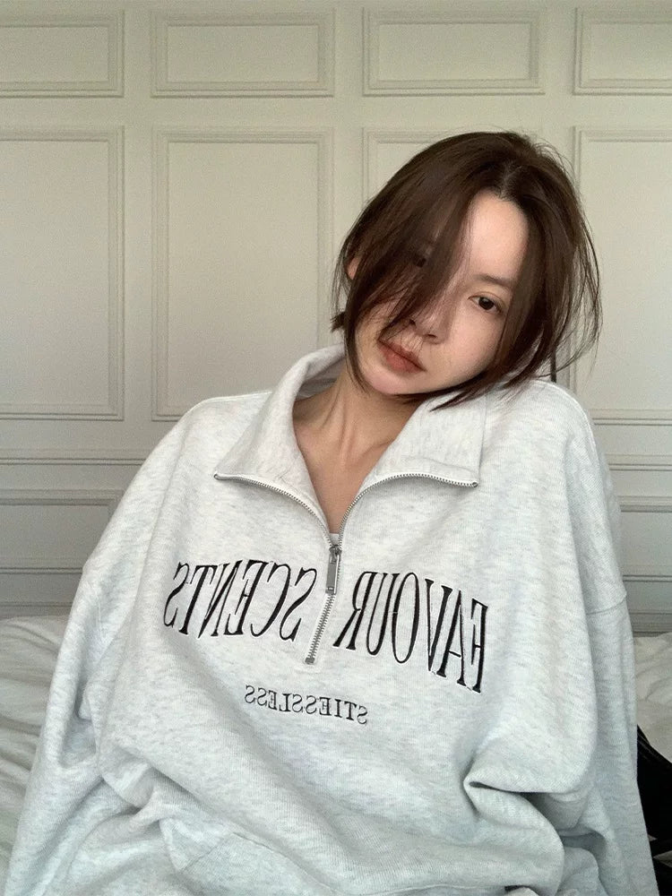 Qadın üçün Amerika üslubunda boz polo yaxalıqlı sviter, nazik, geniş, böyük ölçülü, Honq Konq üslubunda şık fermuarlı top/gödəkçə.