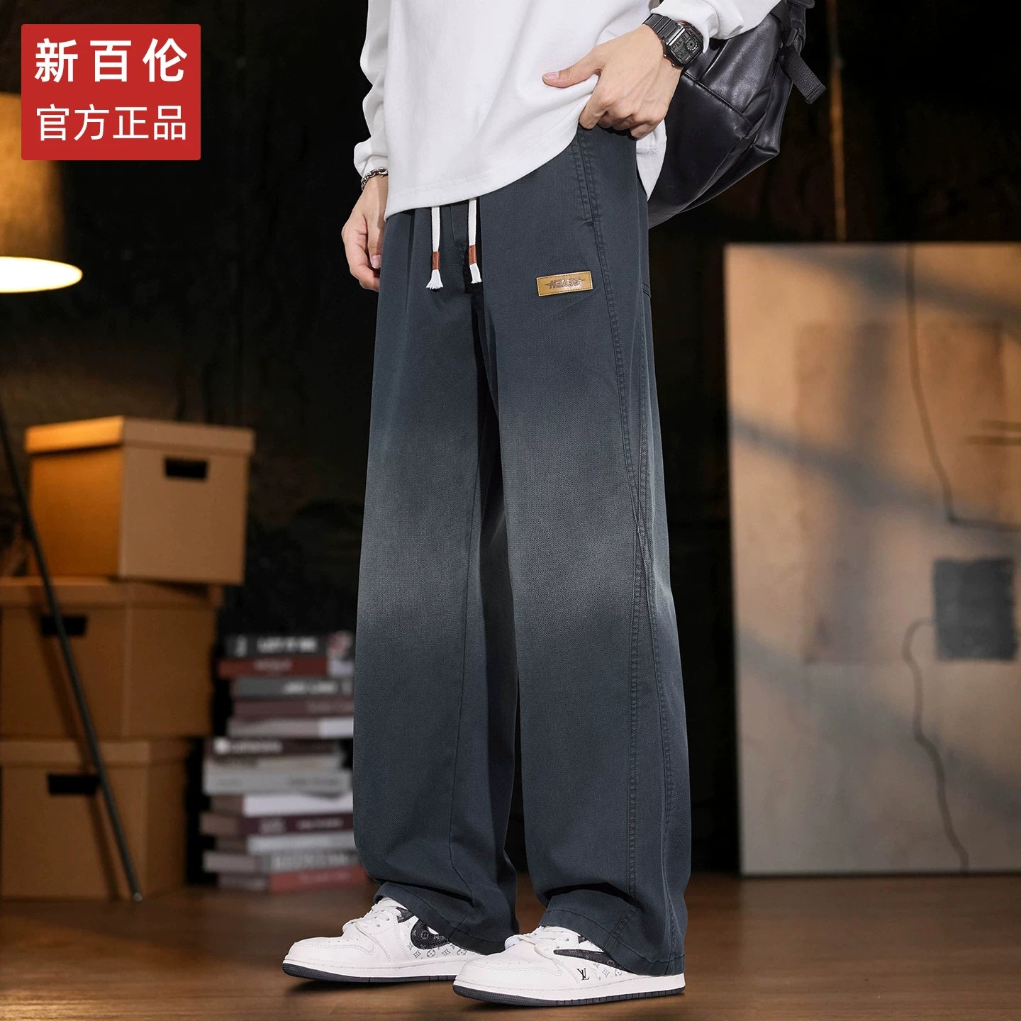 New Balance kişilər üçün Amerika üslubunda enli ayaqlı cins şalvar, 2025-ci ilin payız/qış yeni üslubunda, boş, düz ayaqlı Tencel gündəlik şalvarı.