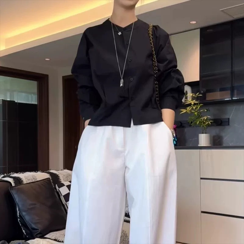 Qadınlar üçün böyük ölçülü, şık qara köynək, 2026-cı ilin yazının əvvəlləri üçün yeni model, geniş formalı, arıqladıcı, uzunqol köynək.