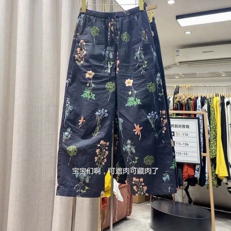 Qadınlar üçün naxışlı gündəlik şalvar, yay üslubunda, nazik, böyük ölçülü, arıqladıcı, qısa, yüksək belli, çoxfunksiyalı, boş, enli ayaqlı, çiçəkli naxışlı şalvar.