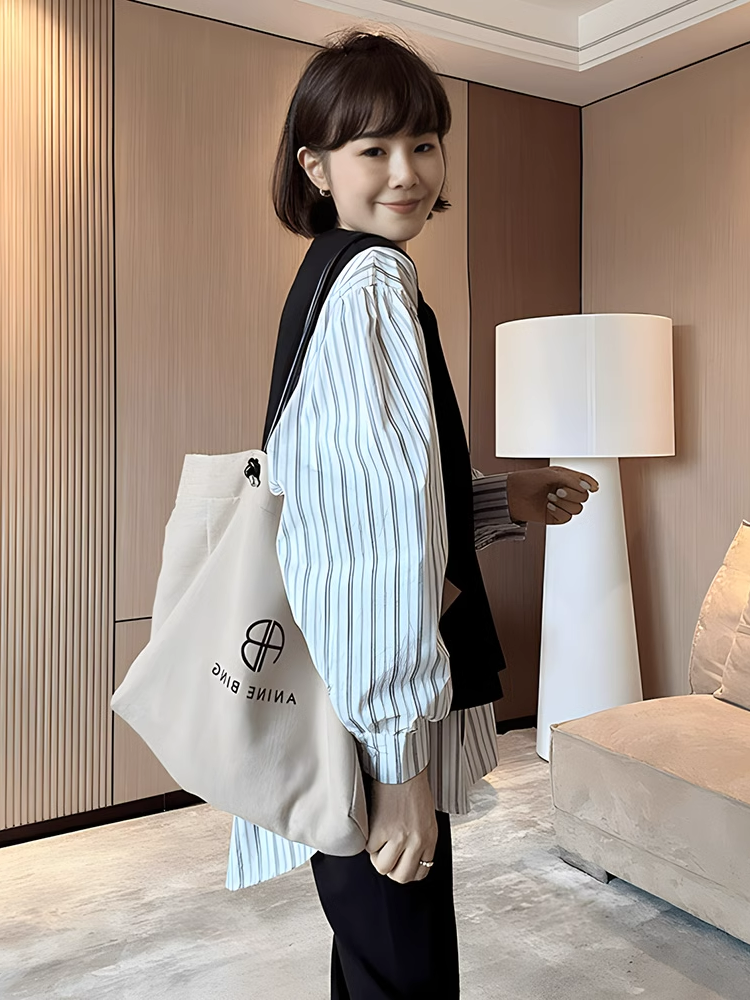 Women's oversized, irregular faux two-piece long-sleeved shirt, new fall and winter fashion, loose-fitting, slimming, unique outerwear shirt.