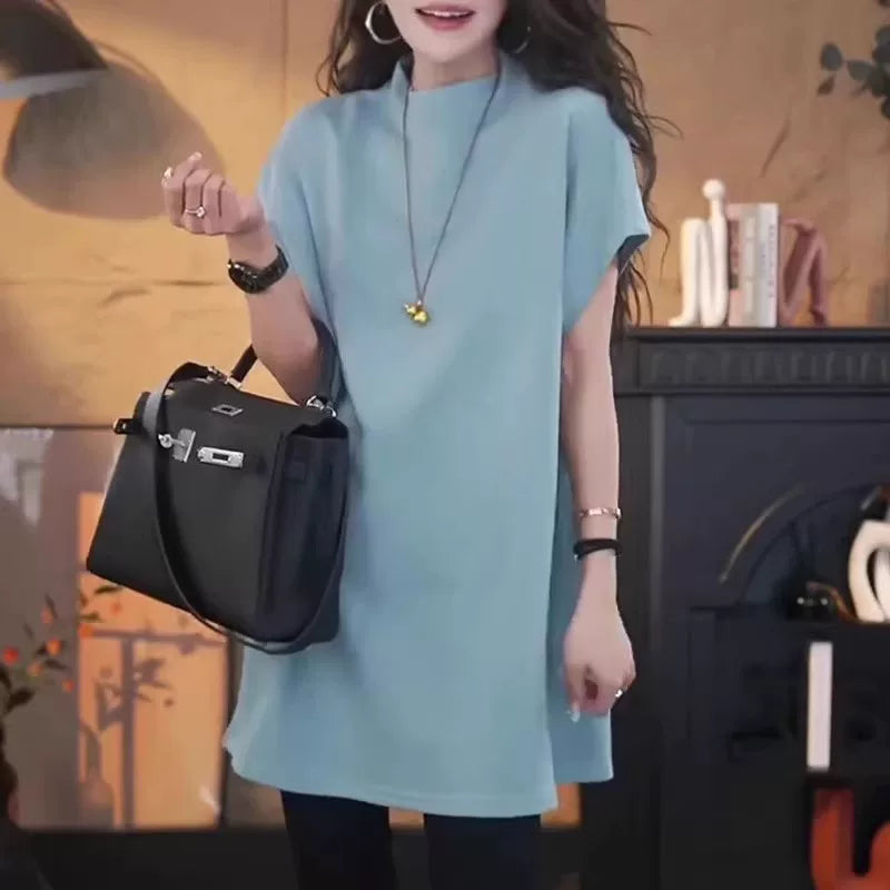 Avropa üslubunda böyük ölçülü qısaqol köynək, böyük ölçülü qadın geyimləri, 2026-cı il yayı, boş forma, orta uzunluqda, kök qızlar üçün yarıqlı top, qarnını gizlədir.