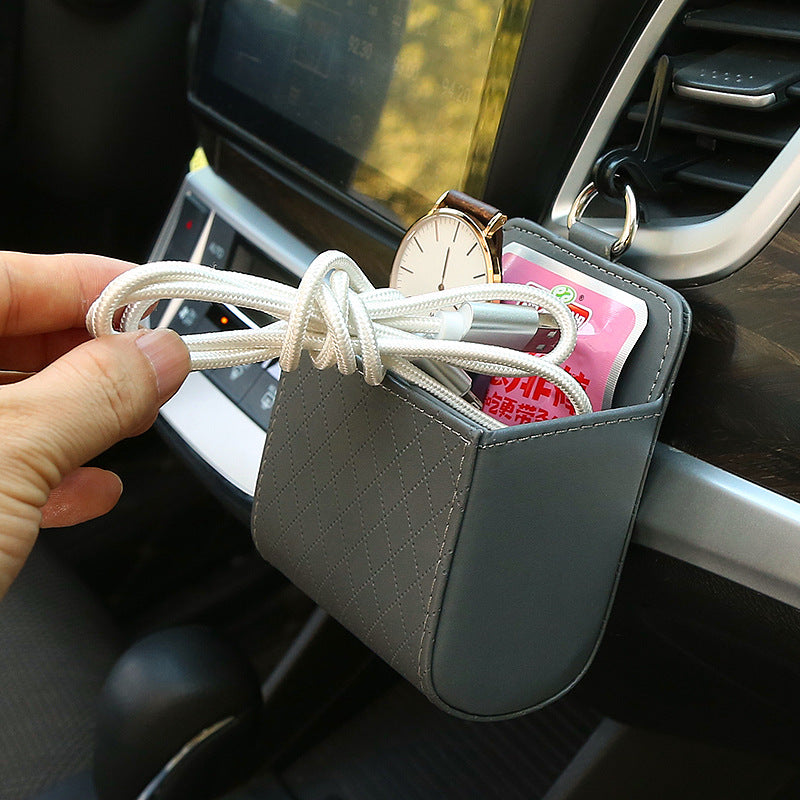 Car storage box, car air vents, leather multi-function pocket for mobile phones, cigarettes, coins, cards and drinks.