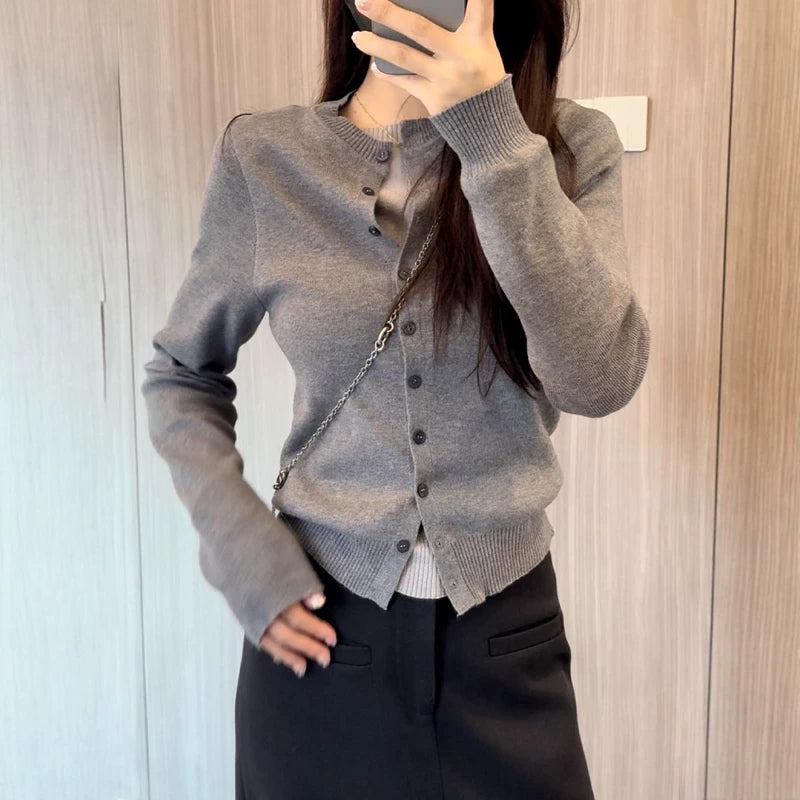 Colorless faux two-piece knit cardigan for plus size women, slimming style, new 2025 fall design, high quality sweater top.