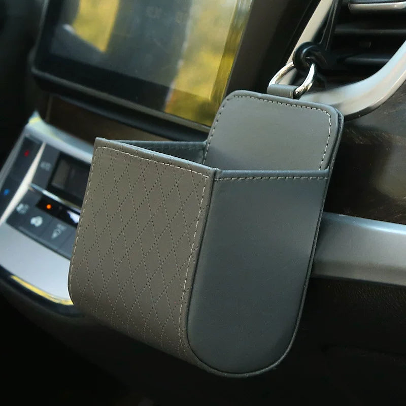 Car storage box, car air vents, leather multi-function pocket for mobile phones, cigarettes, coins, cards and drinks.