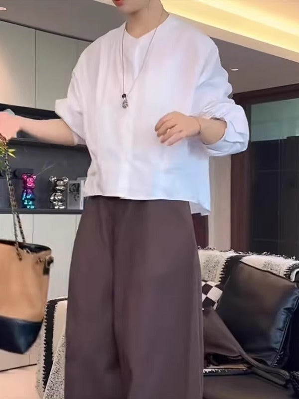 Qadınlar üçün böyük ölçülü, şık qara köynək, 2026-cı ilin yazının əvvəlləri üçün yeni model, geniş formalı, arıqladıcı, uzunqol köynək.