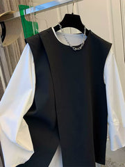 A classy, ​​stylish, versatile and elegant black suit vest shirt set, perfect for layering in the spring of 2025.