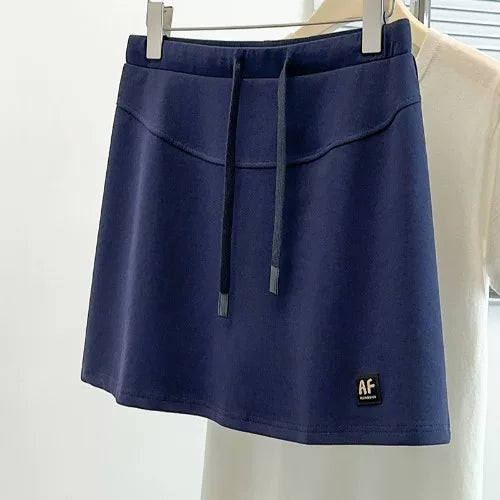 2026-cı ilin yayı üçün böyük ölçülü qadın gündəlik idman ətəyi, incə bədən quruluşu üçün yaraşıqlı, ombaları gizlədən, A-xəttli ətək, qısa ətək.