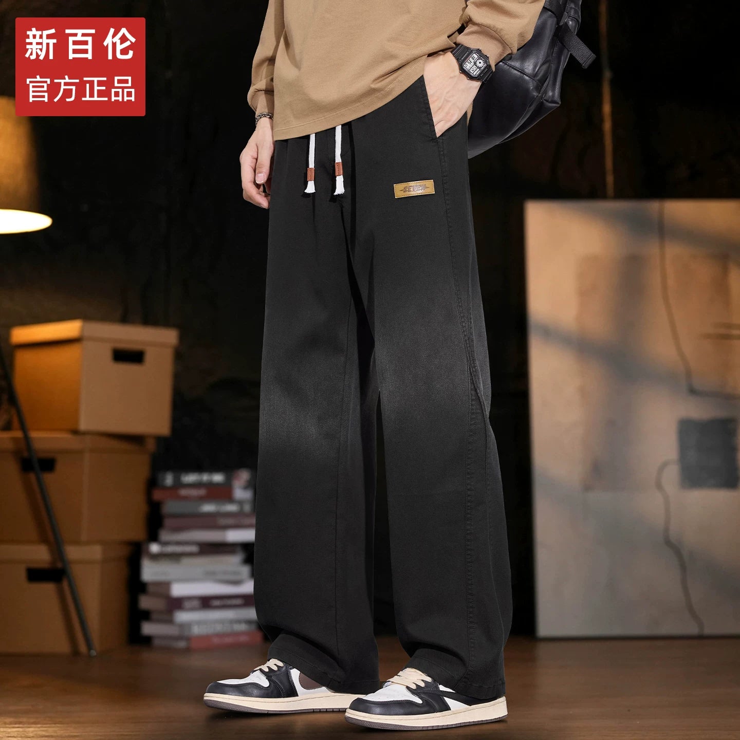 New Balance kişilər üçün Amerika üslubunda enli ayaqlı cins şalvar, 2025-ci ilin payız/qış yeni üslubunda, boş, düz ayaqlı Tencel gündəlik şalvarı.