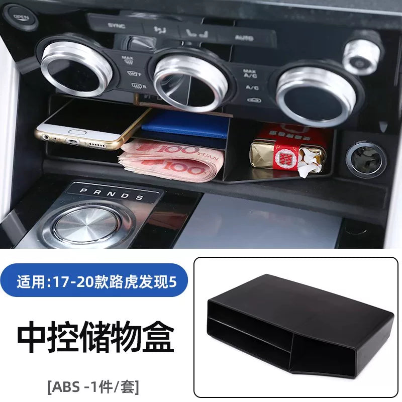2017-2025-ci illərin Land Rover Discovery 5 modelləri üçün uyğun olan bu xüsusiyyət mərkəzi konsolda laylı saxlama qutusu və gizli saxlama üçün qoltuqaltı bölməsini əhatə edir.
