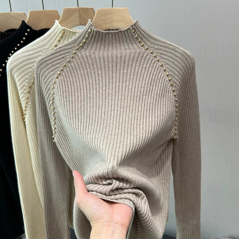 A must-have! This stylish, high-neck, long-sleeved knit shirt is a new, stylish design with a ribbed texture and is perfect for layering.