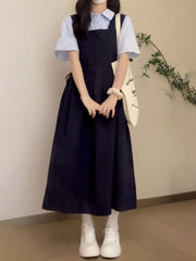 Yay hazırlığı üslubunda, geniş bədən quruluşlu, arıqladıcı kvadrat yaxalı, tünd göy rəngli asma don, qız tələbələr üçün uyğundur, mavi rəngli çoxfunksiyalı köynəklə üst-üstə düşmüşdür.