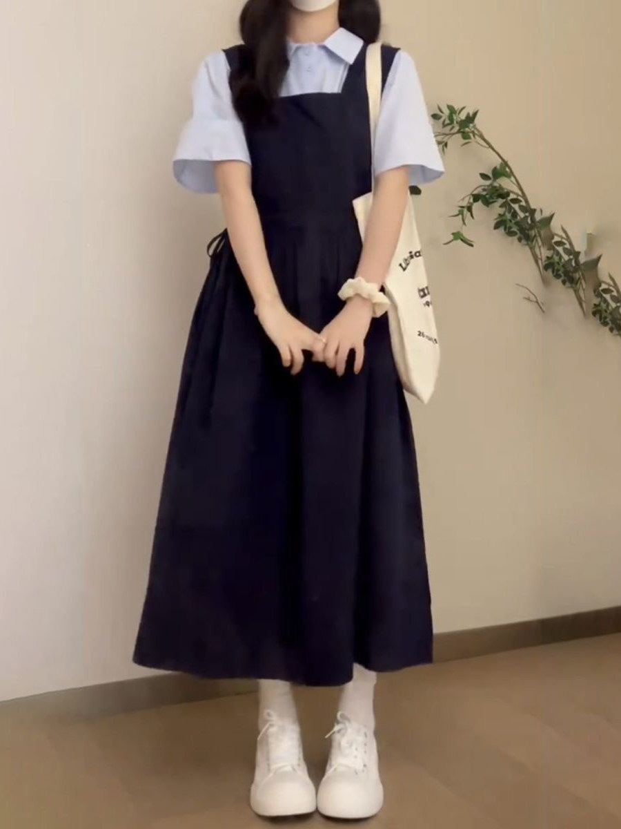 Yay hazırlığı üslubunda, geniş bədən quruluşlu, arıqladıcı kvadrat yaxalı, tünd göy rəngli asma don, qız tələbələr üçün uyğundur, mavi rəngli çoxfunksiyalı köynəklə üst-üstə düşmüşdür.