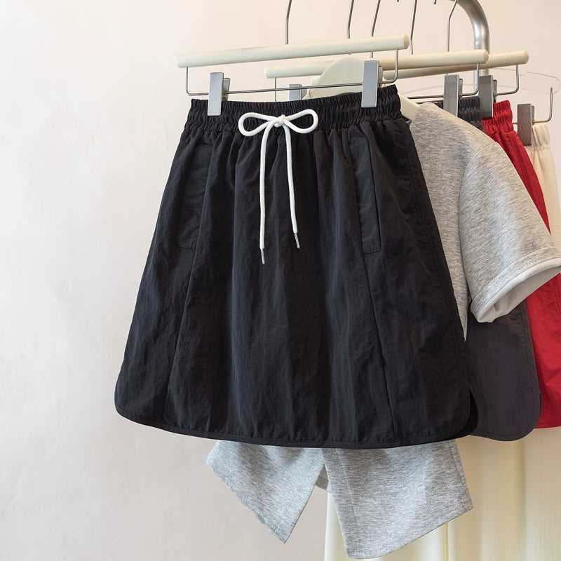 Qadınlar üçün Böyük Ölçülü Şirin və Sərin Yüksək Belli A-xəttli Ətək, 2026 Yeni Yay Modeli, Böyük Ölçülü Armud Formalı Fiqurlar üçün Arıqladıcı Yük Ətəyi