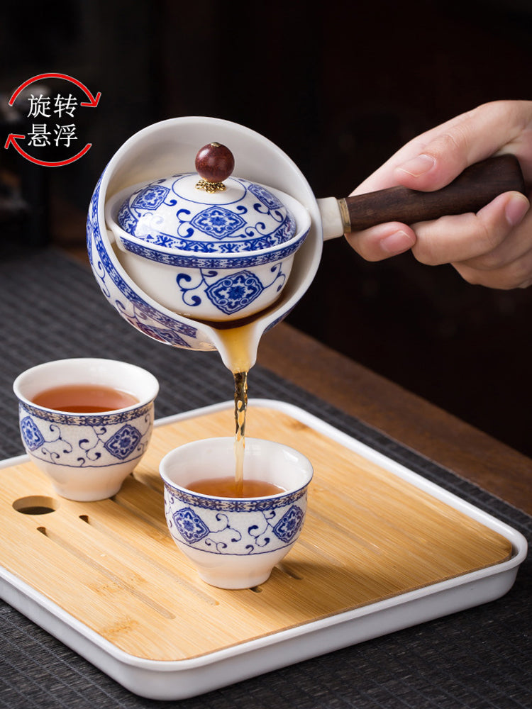 Fırlanan Xiaoyao çaydanı Xiaokang avtomatik çay dəsti çay hazırlamaq üçün xüsusi yeni üslubda yan tutacaq çaydanı ev istifadəsi üçün səyahət dəsti