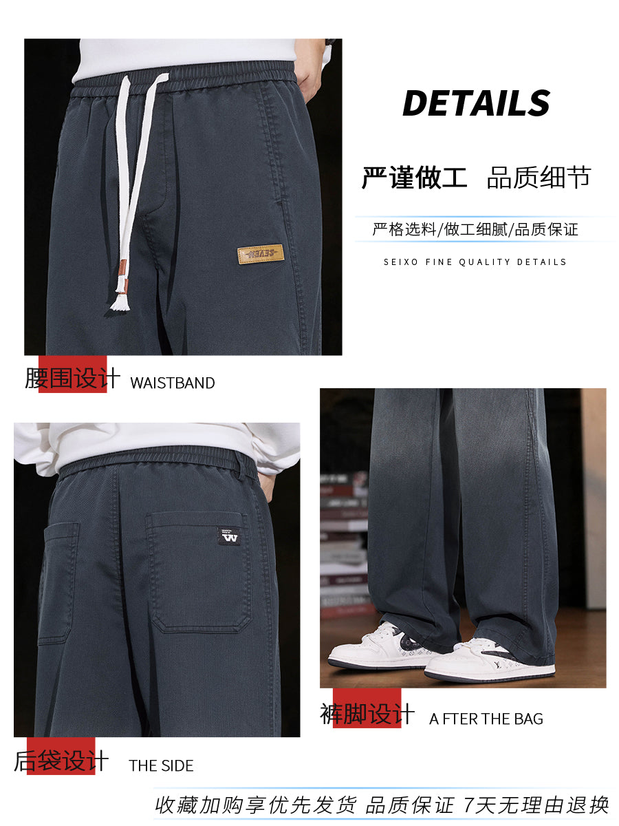 New Balance kişilər üçün Amerika üslubunda enli ayaqlı cins şalvar, 2025-ci ilin payız/qış yeni üslubunda, boş, düz ayaqlı Tencel gündəlik şalvarı.