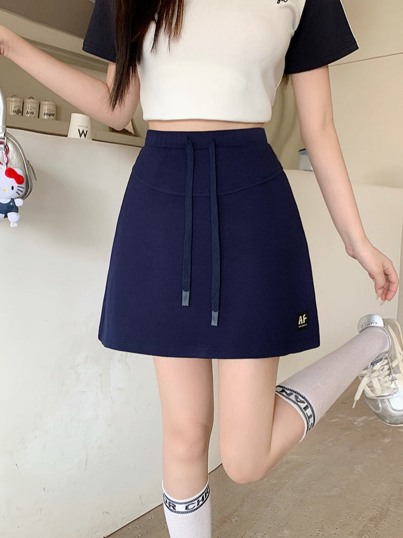 Böyük ölçülü qadın gündəlik idman sviteri, 2026-cı il yay yeni dəbi, yüksək belli, kalçanı örtən, arıqladıcı A-xəttli ətək/qısa ətək