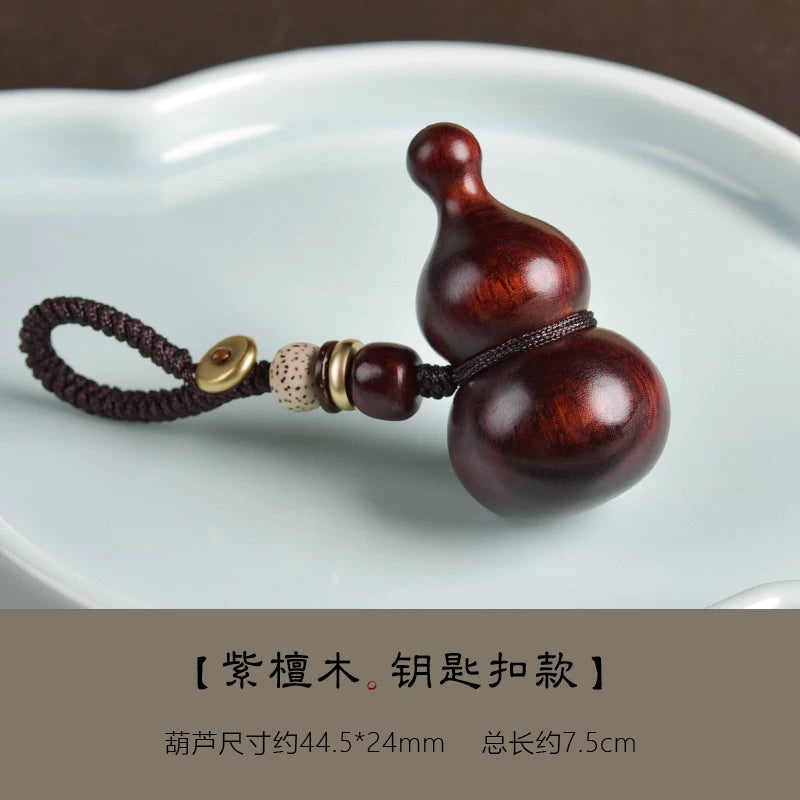 Bənövşəyi səndəl ağacından hazırlanmış balqabaq avtomobil açar zənciri, yaşıl səndəl ağacından hazırlanmış sülh və bəxt kulonu, kişilər və qadınlar üçün yaradıcı portativ zərgərlik.