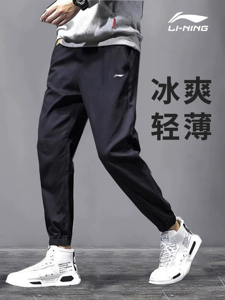 Li Ning tez quruyan idman şalvarı kişi yay yeni nəfəs ala bilən təsadüfi leggings şalvar fitnes qaçış idman şalvarı toxunmuş şalvar