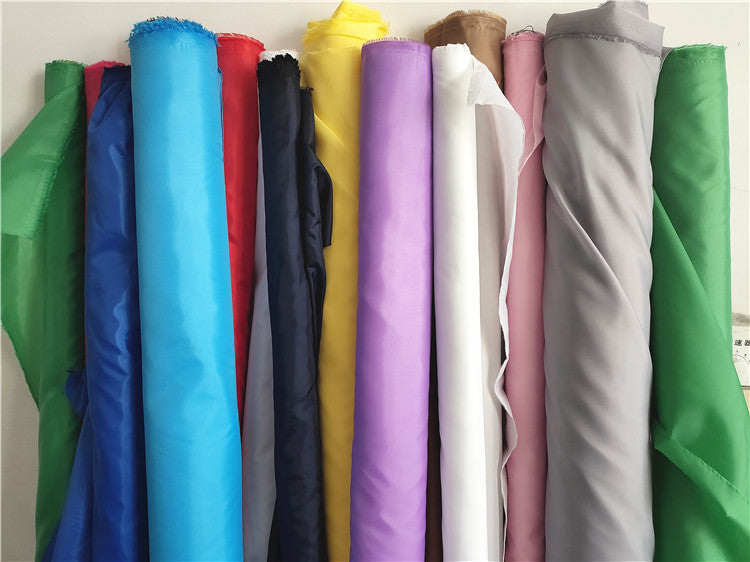 Bərk rəngli kimyəvi lifli parça, polyester paltar astarlı parça, çanta yubka astarlı parça, toy səhnə tərtibatı dekorativ parça