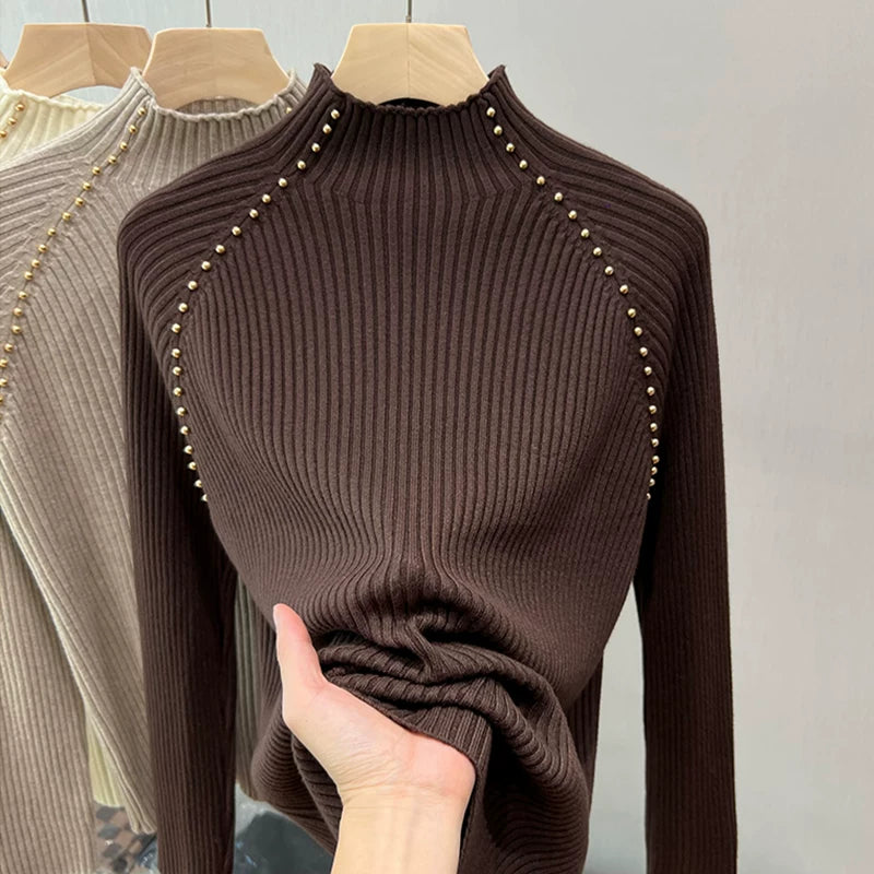 A must-have! This stylish, high-neck, long-sleeved knit shirt is a new, stylish design with a ribbed texture and is perfect for layering.