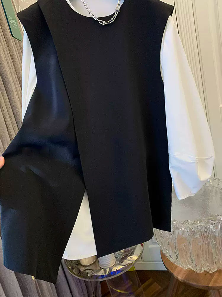 A classy, ​​stylish, versatile and elegant black suit vest shirt set, perfect for layering in the spring of 2025.