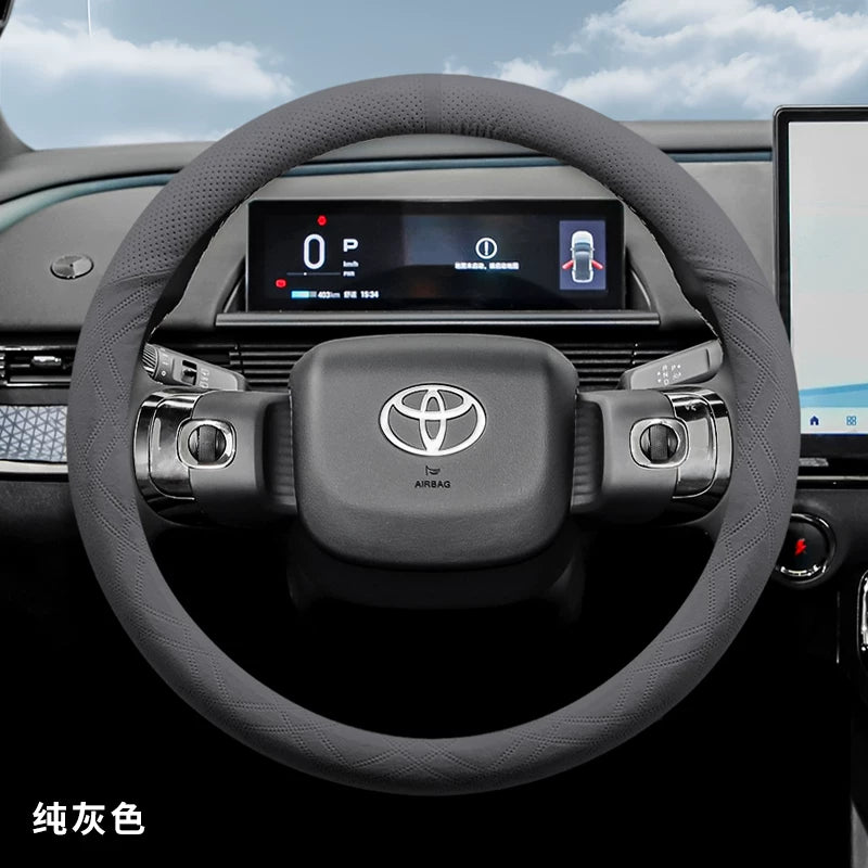 2025 Toyota Corolla üçün sükan örtüyü, zamşa və sürüşməyən, təri udma materialından hazırlanmışdır.