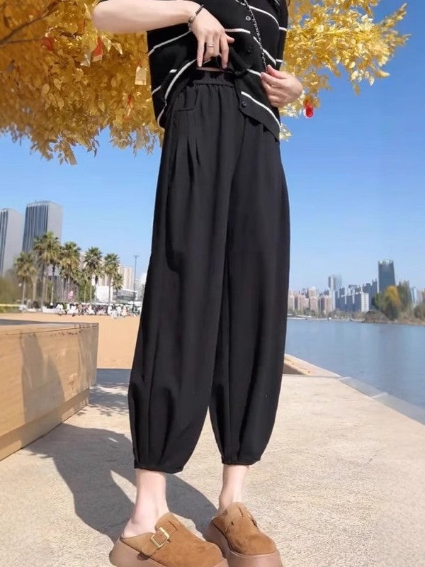Qadın qara qısa hərəm şalvarı, 2026 yay stilində, böyük ölçüdə, yüksək belli, arıqladıcı və gündəlik. Kiçik bədən quruluşlu qadınlar üçün uyğundur.