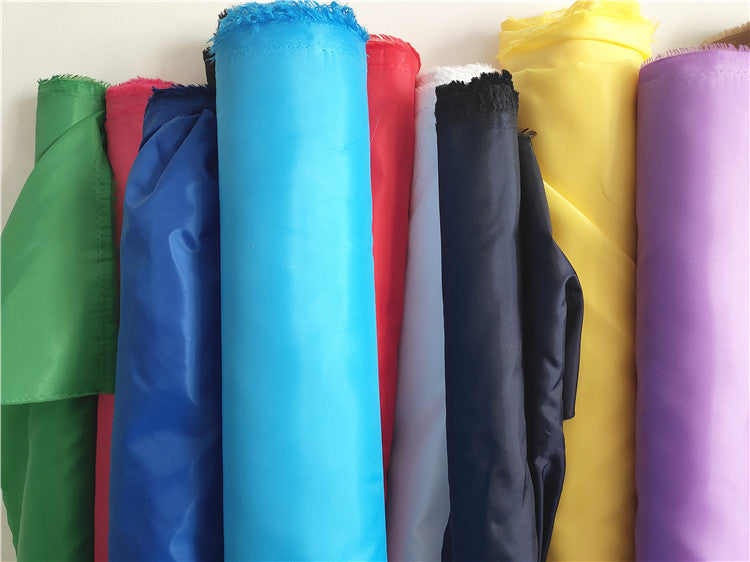Bərk rəngli kimyəvi lifli parça, polyester paltar astarlı parça, çanta yubka astarlı parça, toy səhnə tərtibatı dekorativ parça